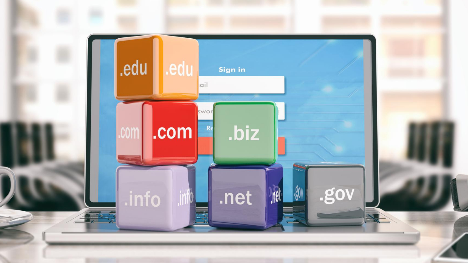 cubes with different TLDs (.com, .net) in front of a laptop screen showing a login dashboard background