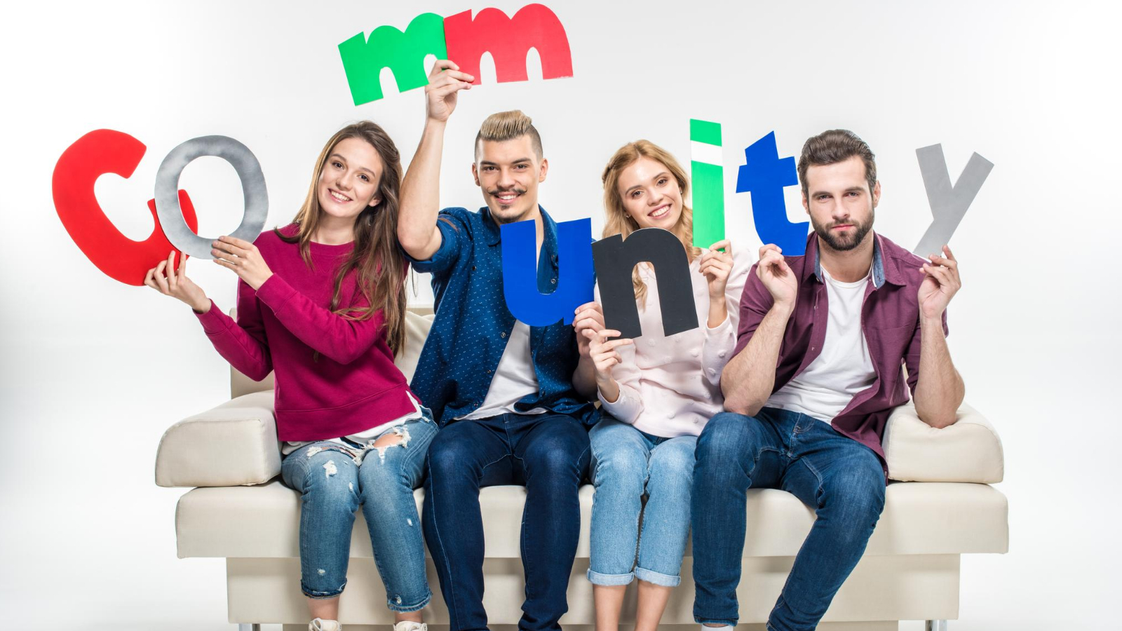 group of people holding up the letters spelling 