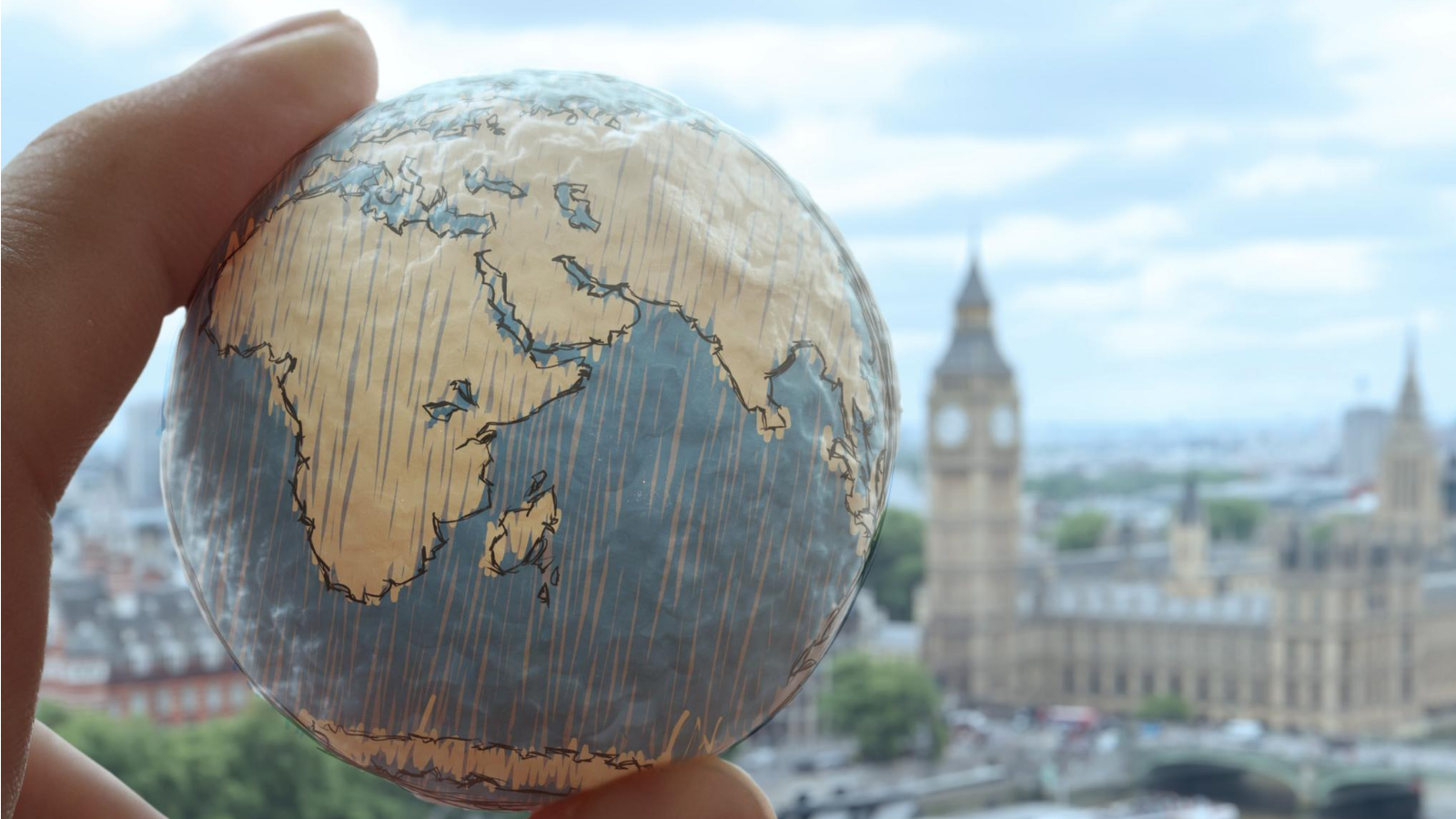 customized globe on a person's hand, illustrating how directories can connect people across the world